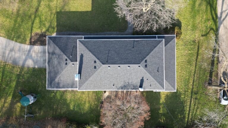 Aerial of patio-home roof, ridge vents and backyard living space