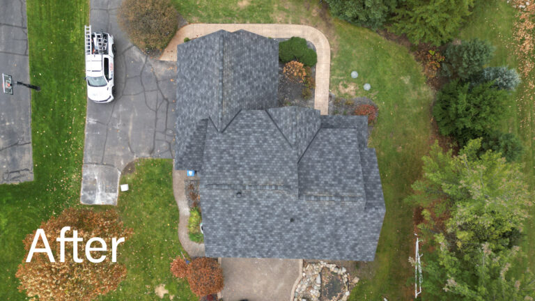 Straight-down drone view of new architectural-shingle roof with white drip edge