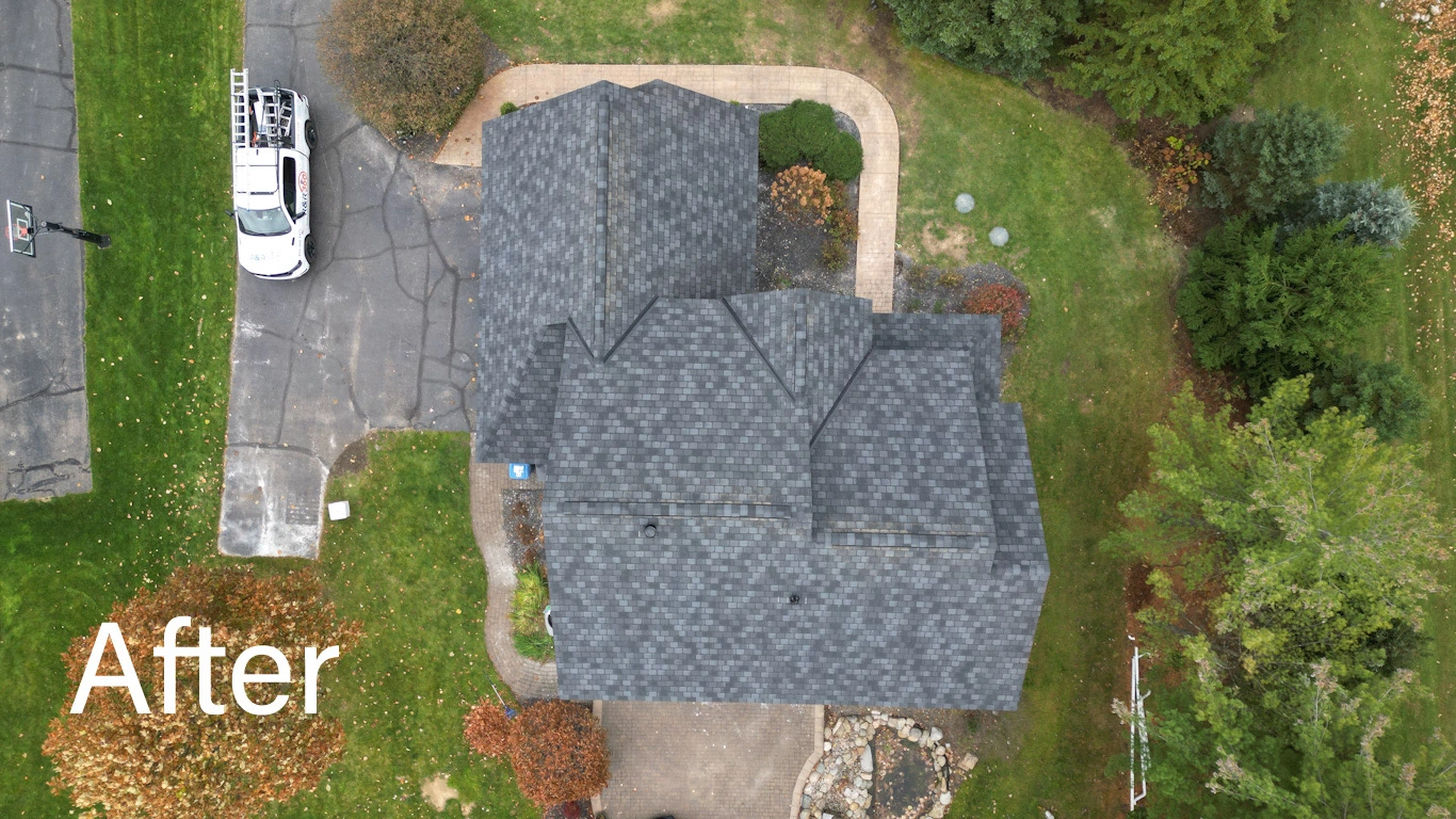 Straight-down drone view of new architectural-shingle roof with white drip edge