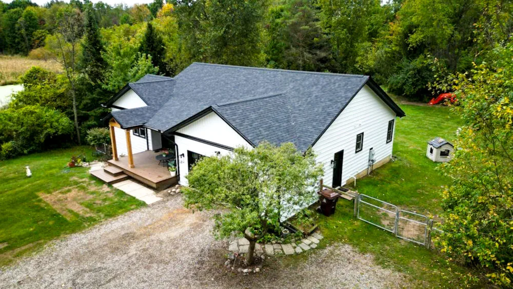 Countryside ranch after roof, white siding and deck renovation by R&R 360
